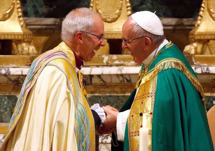 Pope Francis smiles with Archbishop of Canterbury Justin Welby at the end of vespers prayers at the monastery church of San Gregorio al Celio in Rome